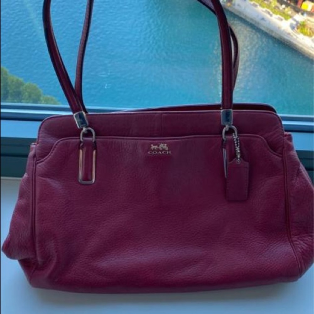 Coach red leather bag. It has multiple pockets